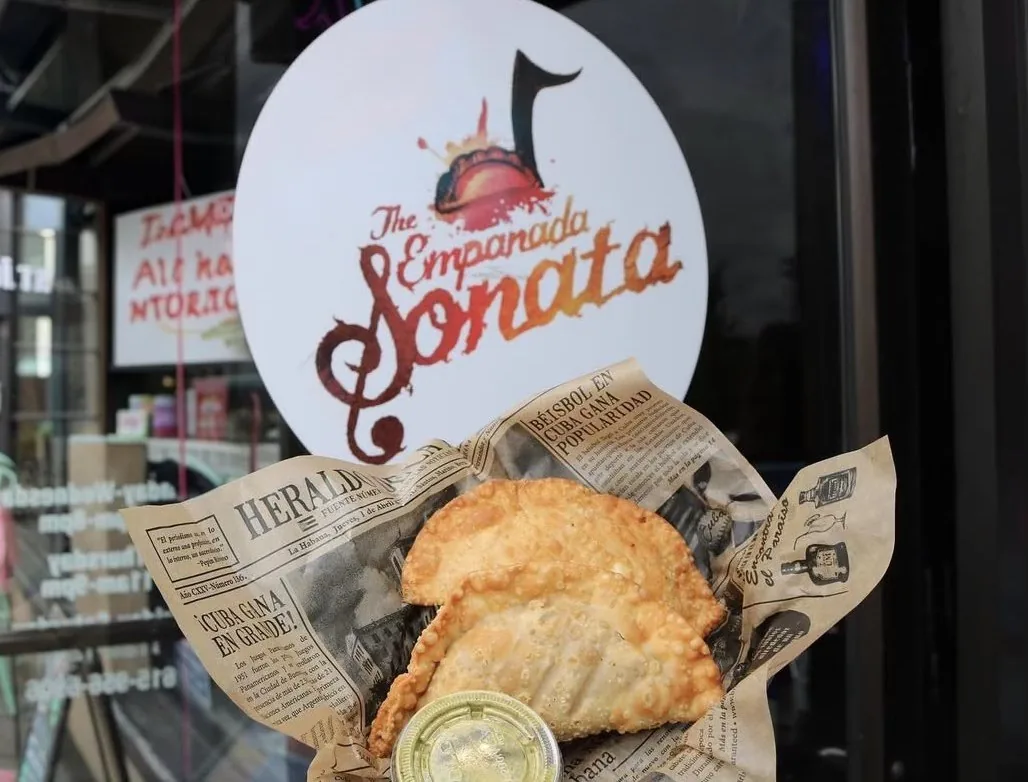 An actual Empanada Sonata display with the company sign and freshly prepared empanadas